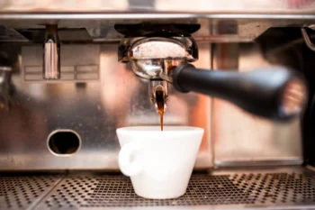 Espresso machine pouring coffee in pub bar resta 2024 09 12 10 36 31 utc